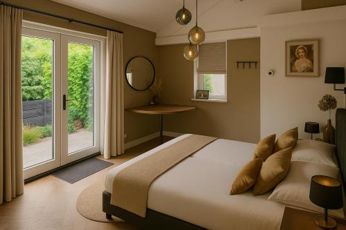 Postel nebo postele na pokoji v ubytování B&B Natuurlijk Harderwijk