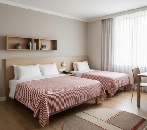 a hotel room with two beds and a window at Doksanlar Apart 