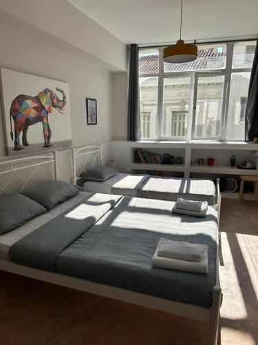 Ένα ή περισσότερα κρεβάτια σε δωμάτιο στο Plaka Rooms