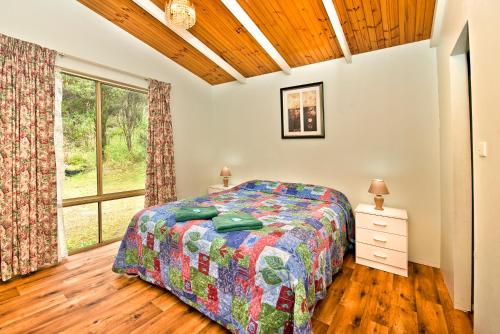 A bed or beds in a room at Acclaim Pine Grove Holiday Park