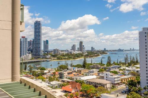 a view of a city with a river and buildings at The Meriton Apartments on Main Beach in Gold Coast