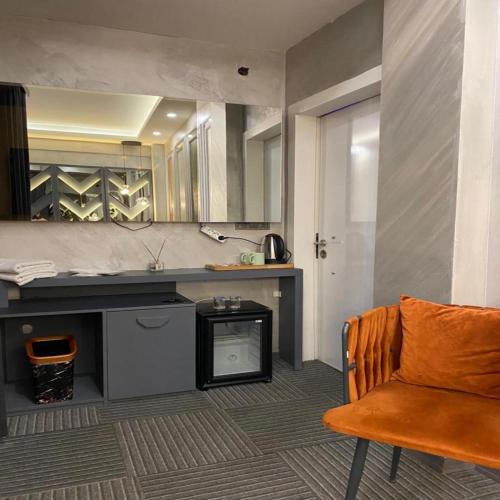 a kitchen with a counter and a chair in a room at Valeron Suit Premium in Istanbul