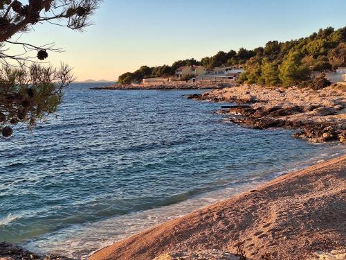 a view of the shore of a body of water at Little Seafront House Dolac Primošten in Dolac