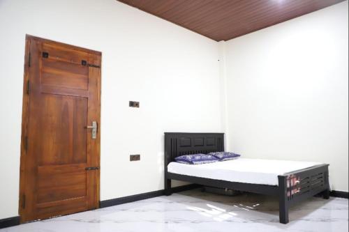 Ένα ή περισσότερα κρεβάτια σε δωμάτιο στο Naren Guest House