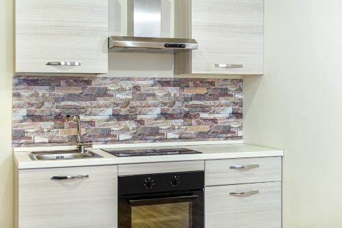 Kuchyň nebo kuchyňský kout v ubytování Rome Aparts