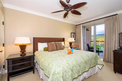 a bedroom with a bed and a ceiling fan at Honua Kai 1024 · HK 1024 Updated Beachfront Luxury Condo w Pool in Lahaina