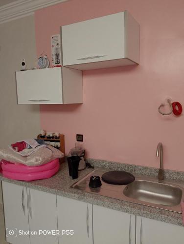 a kitchen with a sink and a counter top at Maison d'hôtes Oujda in Oujda