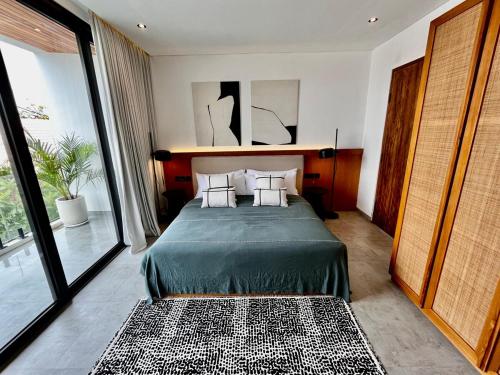 En eller flere senge i et værelse på Apartment Wati 4 Umalas