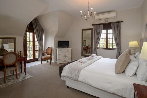 Postel nebo postele na pokoji v ubytování Dark Chocolate Guest House