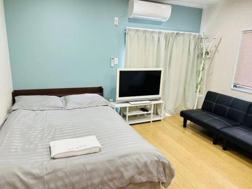 Ένα ή περισσότερα κρεβάτια σε δωμάτιο στο Hiregasaki, Nagareyama 1号