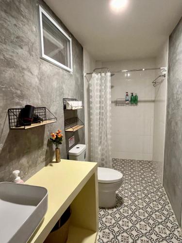 a bathroom with a sink and a toilet and a shower at The Summer Cottage Koh Chang in Khlaung Phai Bae