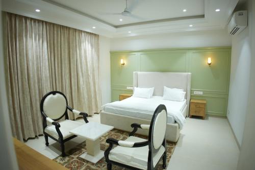 Postel nebo postele na pokoji v ubytování Kaayanaat Villa