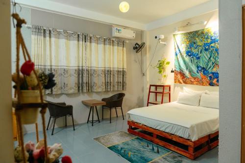 Ένα ή περισσότερα κρεβάτια σε δωμάτιο στο Bụi Hostel - Ferry to Rạch Giá