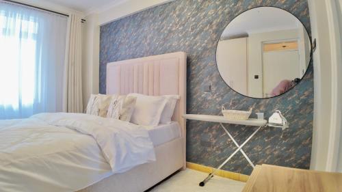 Ένα ή περισσότερα κρεβάτια σε δωμάτιο στο Paz Home's Kiambu Road
