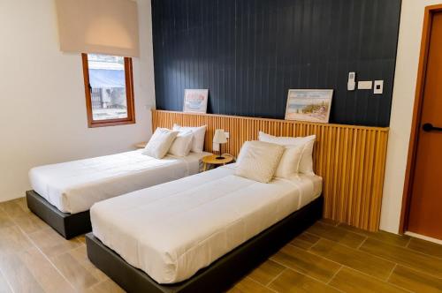 En eller flere senge i et værelse på Holmestay-Best location! Comfort room!