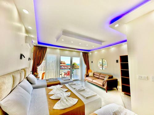 a living room with a bed and a couch at Hagia Sophia Palace Hotel in Istanbul