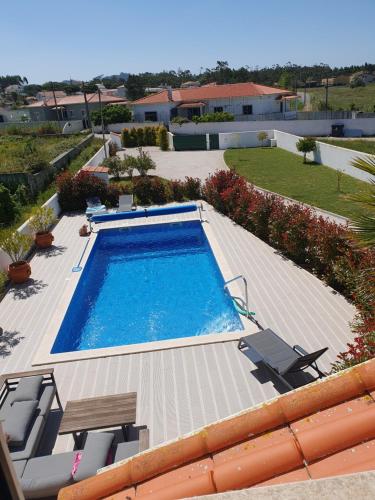 an overhead view of a swimming pool on a house at Quinta da Familia in Caldas da Rainha