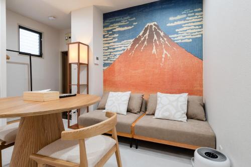 a living room with a couch and a table at Lucky you! SHIBUYA in Tokyo