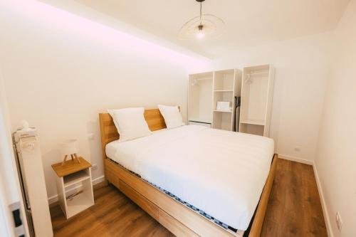 Postel nebo postele na pokoji v ubytování Appartement lumineux et calme sur la Route des vins