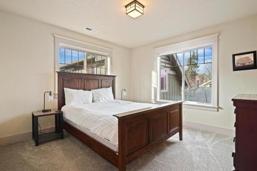 a bedroom with a large bed and a window at Awbrey in Bend