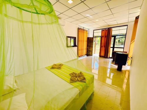 Ένα ή περισσότερα κρεβάτια σε δωμάτιο στο Hotel 4u Udawalawe