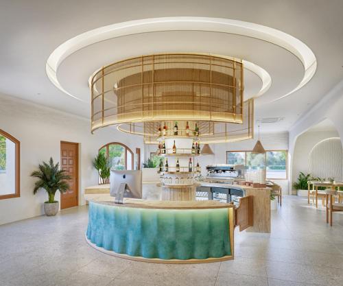 a large living room with a large chandelier at Noska Hotel in Phu Quoc