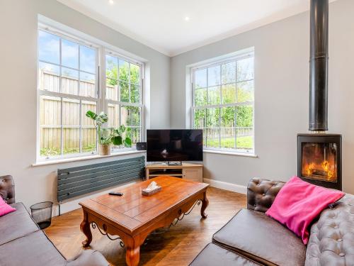 a living room with a couch and a coffee table at Hillside - Uk48202 in Stockbury