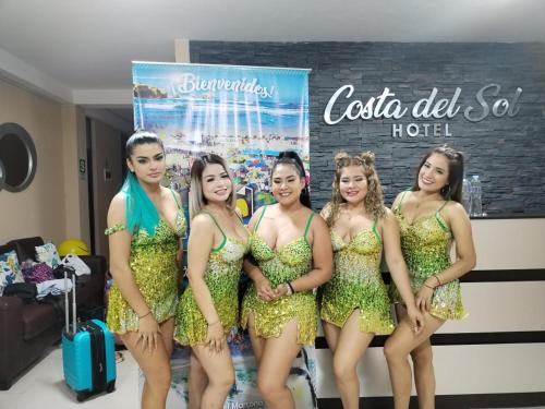 a group of girls in gold costumes posing for a picture at Hotel costa del Sol Marcona in San Juan de Marcona