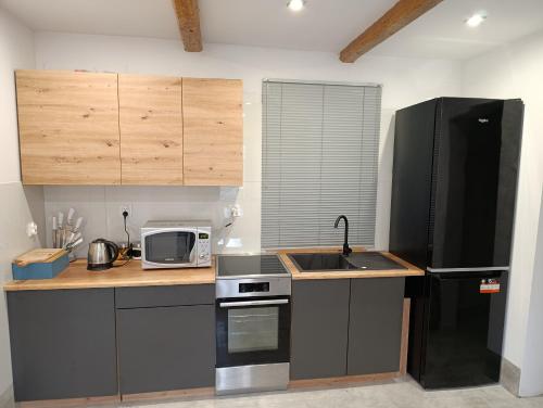 Kuchyň nebo kuchyňský kout v ubytování PokojeS12