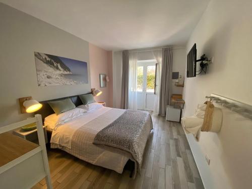 Postel nebo postele na pokoji v ubytování metrisulmare