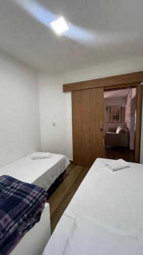 En eller flere senge i et værelse på Casa em Diamantina