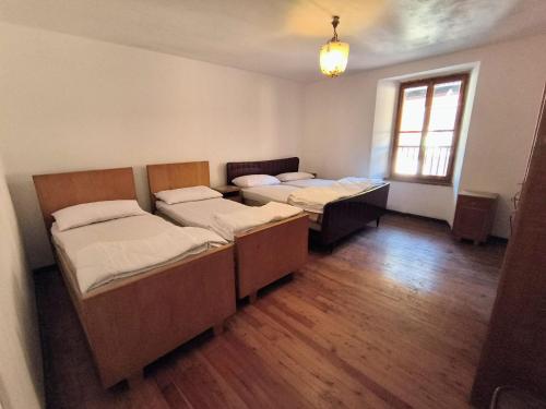 Ένα ή περισσότερα κρεβάτια σε δωμάτιο στο BROWN DOLOMYTE Apartment