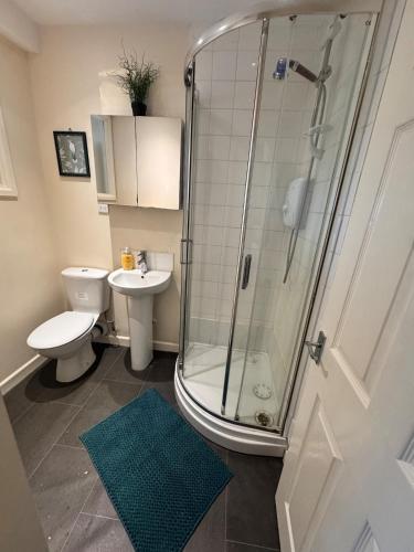 a bathroom with a shower and a toilet and a sink at #81 Stylish Top Floor - for 2 - 10 mins to Brueton Park - " Perfect for Business Traveler and Couple - Free Parking" in Shirley