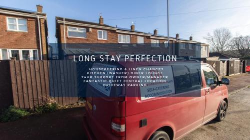 a red van with a sign on the side of it at Free Parking 3 Double Bedroom Sunderland House 10 mins drive to Nissan Ideal for Long Term Contractor etc Stays - see our Dwellcome Home Ltd site for assurance in Pallion