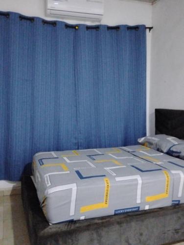 En eller flere senge i et værelse på Roominlapaz