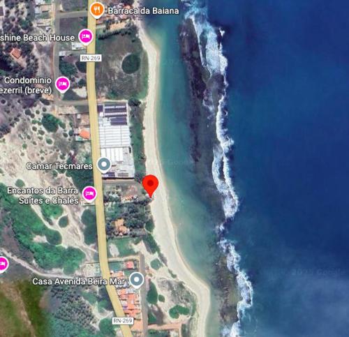 a map of a beach with a red marker at Pousada Ventoria in Canguaretama