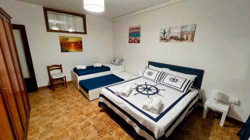 Cama o camas de una habitación en Gente di Mare Apartment Tropea Center