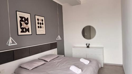 Postel nebo postele na pokoji v ubytování Kutaisi Glow