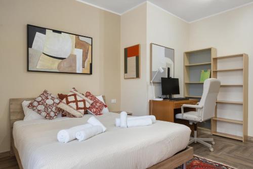 a bedroom with a bed with a desk and a chair at Conca D'Oro Guest House - Stefania in Rome