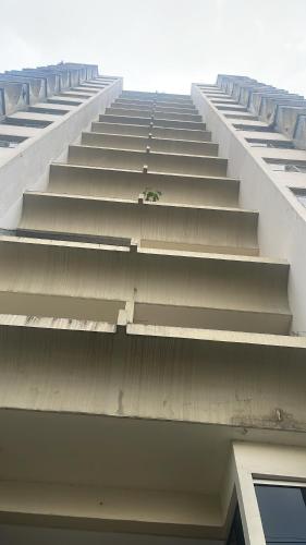 a large white building with stairs on the side of it at Apartamento aconchegante in Belém