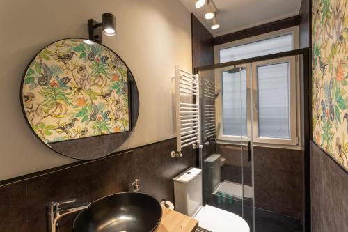a bathroom with a sink and a mirror at New Bilbao city center in Bilbao