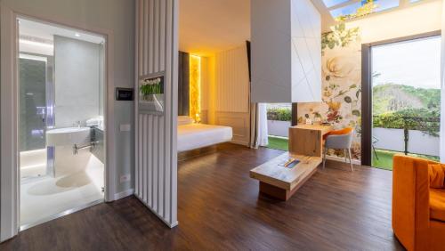 a bathroom with a sink and a toilet and a tub at Hotel Salus Terme - Adults Only in Viterbo