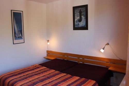 En eller flere senger på et rom på Hauts De Chaviere Appartements VTI