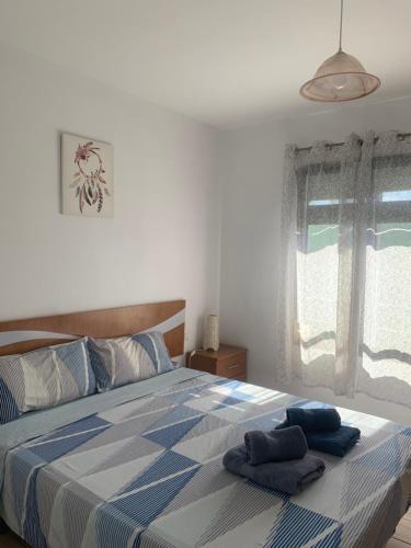 Postel nebo postele na pokoji v ubytování Apartments Tazacorte Beach 2-3 floor