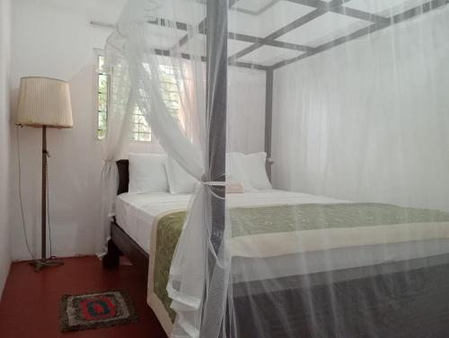 Postel nebo postele na pokoji v ubytování Omandi Villa