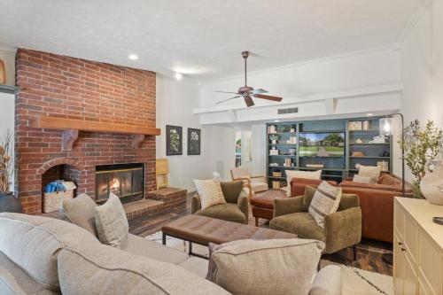 a living room filled with furniture and a fireplace at May Specials - Private Pool, Family Friendly! in The Colony