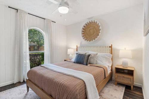 a bedroom with a large bed and a window at May Specials - Private Pool, Family Friendly! in The Colony