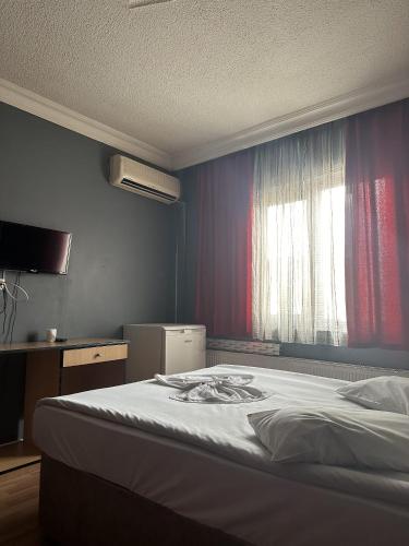 Postel nebo postele na pokoji v ubytování Prenses Otel