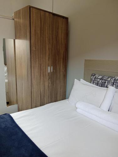 Postel nebo postele na pokoji v ubytování Melee's house