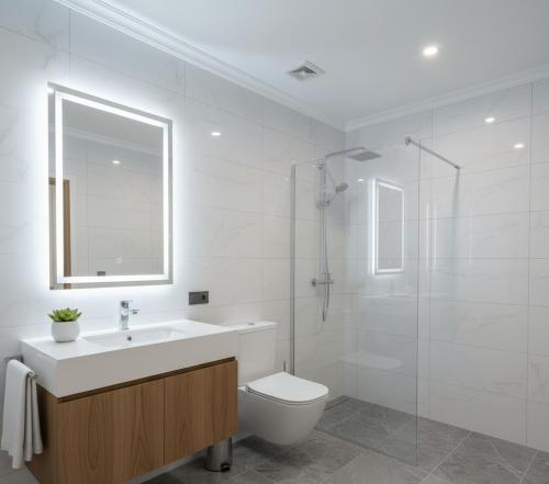 a bathroom with a toilet and a sink and a shower at Trabzon Live Hotel in Bostancı